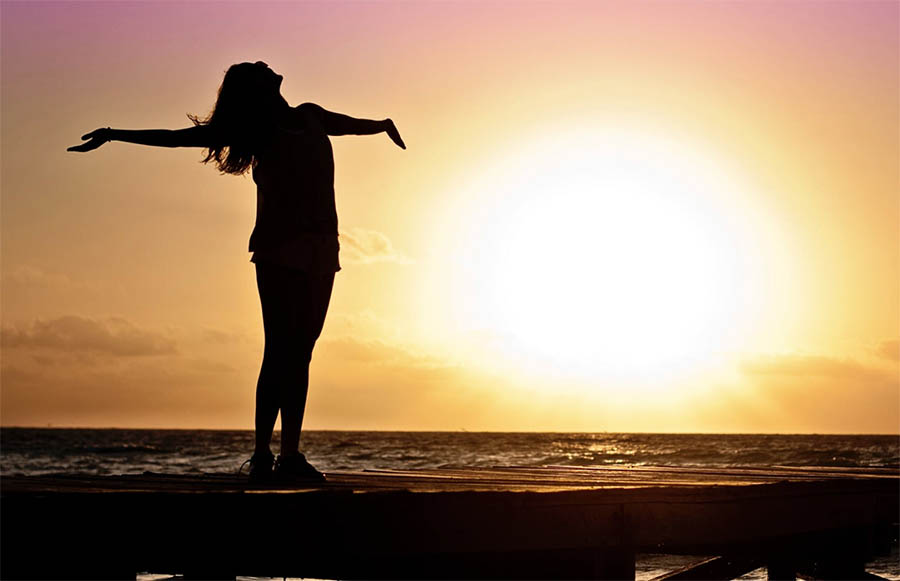 Woman enjoying exercise as part of her routine to help prevent relapse in addiction recovery.