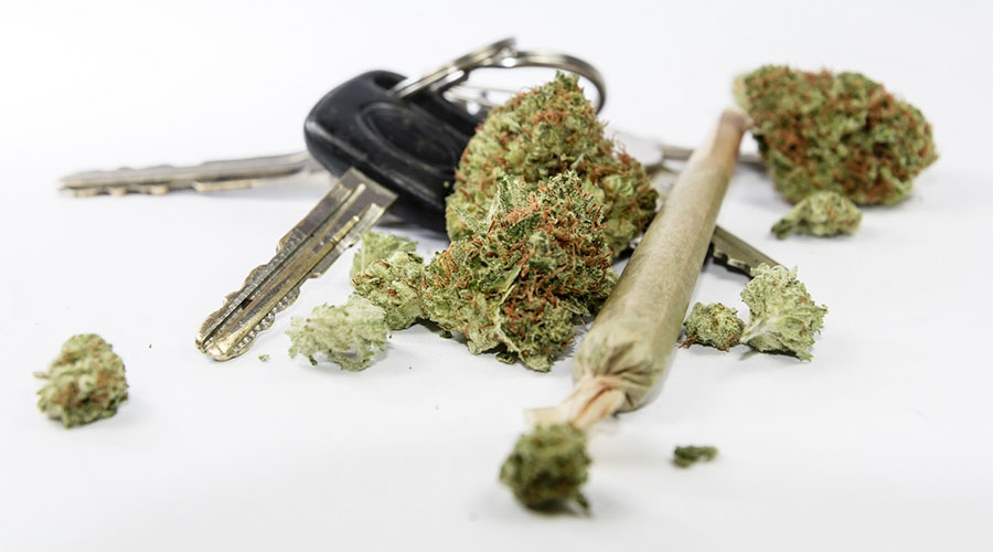 Marijuana driving laws - car keys with buds of pot and a joint