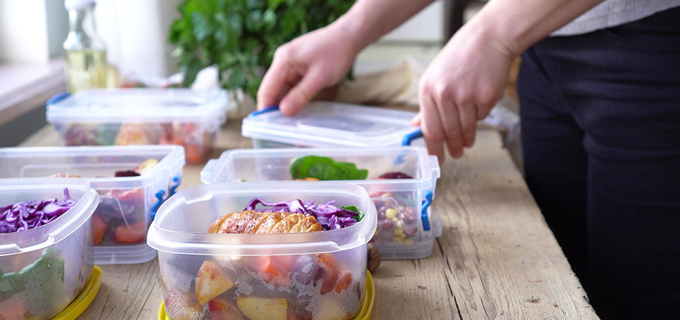 A closeup of someone preparing meals for the week, nutritious meal prep can be a great way to ensure you eat healthy in recovery.