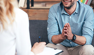 A man meets with his therapist after finishing detoxing at a drug rehab.