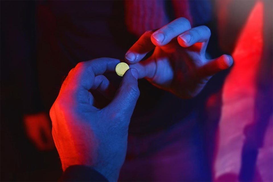 Rohypnol, or "roofies" being exchanged, a drug that for some carries addictive consequences.