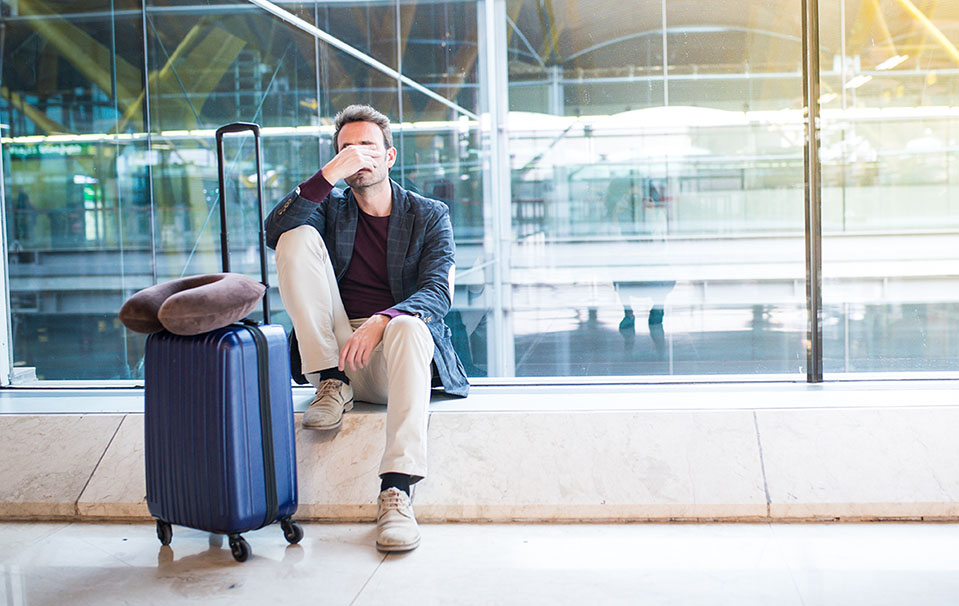 Man at the airport with suitcase headed to out of state rehab