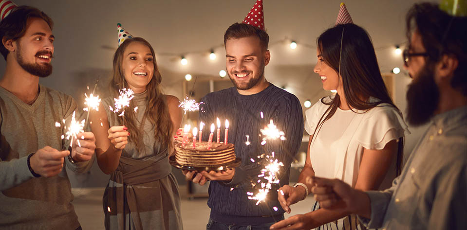 A friend bakes a cake and gives it to a man on his birthday. Happy and stress-free by giving to others and being selfless.