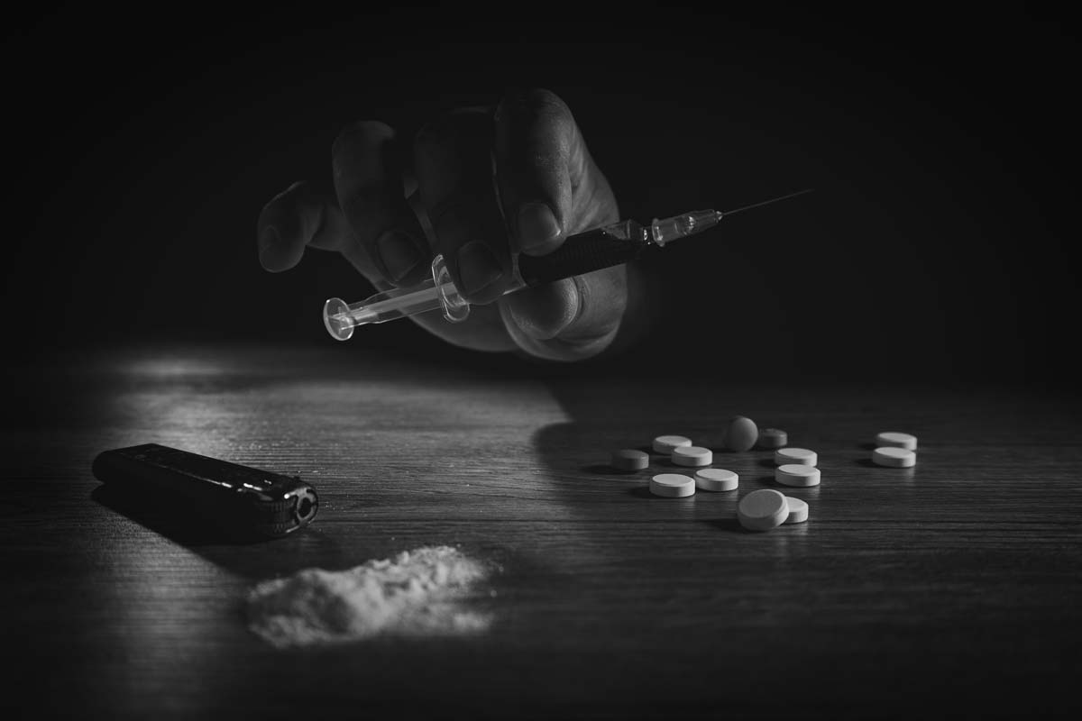 Stop drug addiction concept International Day against Drug syringe and cooked heroin on spoon
