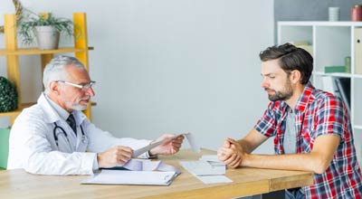 Man receiving a consultation for addiction treatment