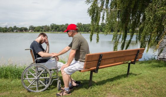 Disable veteran talking to an older veteran about addiction treatment in Lake Forest