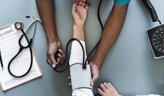 Medical professional checking patient’s blood pressure during medically induced drug detox at 12 South Recovery in Lake Forest, CA.