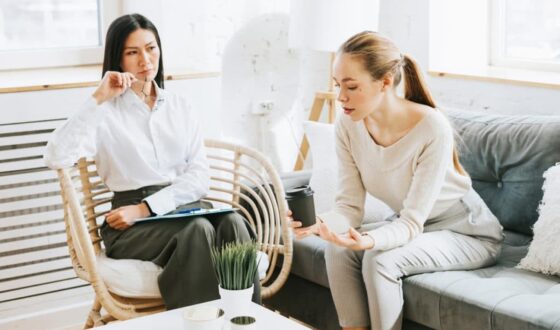 Therapist listening to young woman during counseling session, representing why co-occurring disorders like addiction and mental health conditions are common in Orange County treatment programs at 12 South Recovery.