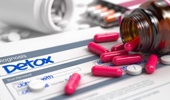 Close-up of spilled medication capsules on a detox form, symbolizing medical detox and treatment for mixing alcohol and drugs at 12 South Recovery in Orange County, CA.