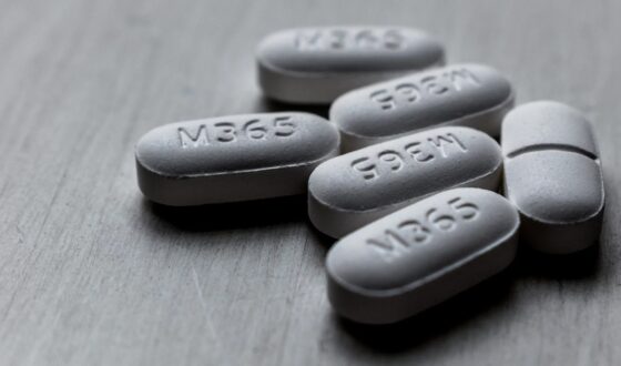 Close-up of white M365 pills on a table, representing the risks of prescription painkiller misuse and opioid addiction awareness at 12 South Recovery in Orange County, CA.