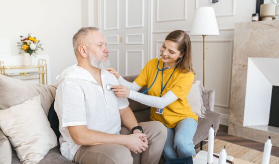 Healthcare professional providing continuing care services to a patient, supporting long-term recovery, wellness, and ongoing treatment after rehab.