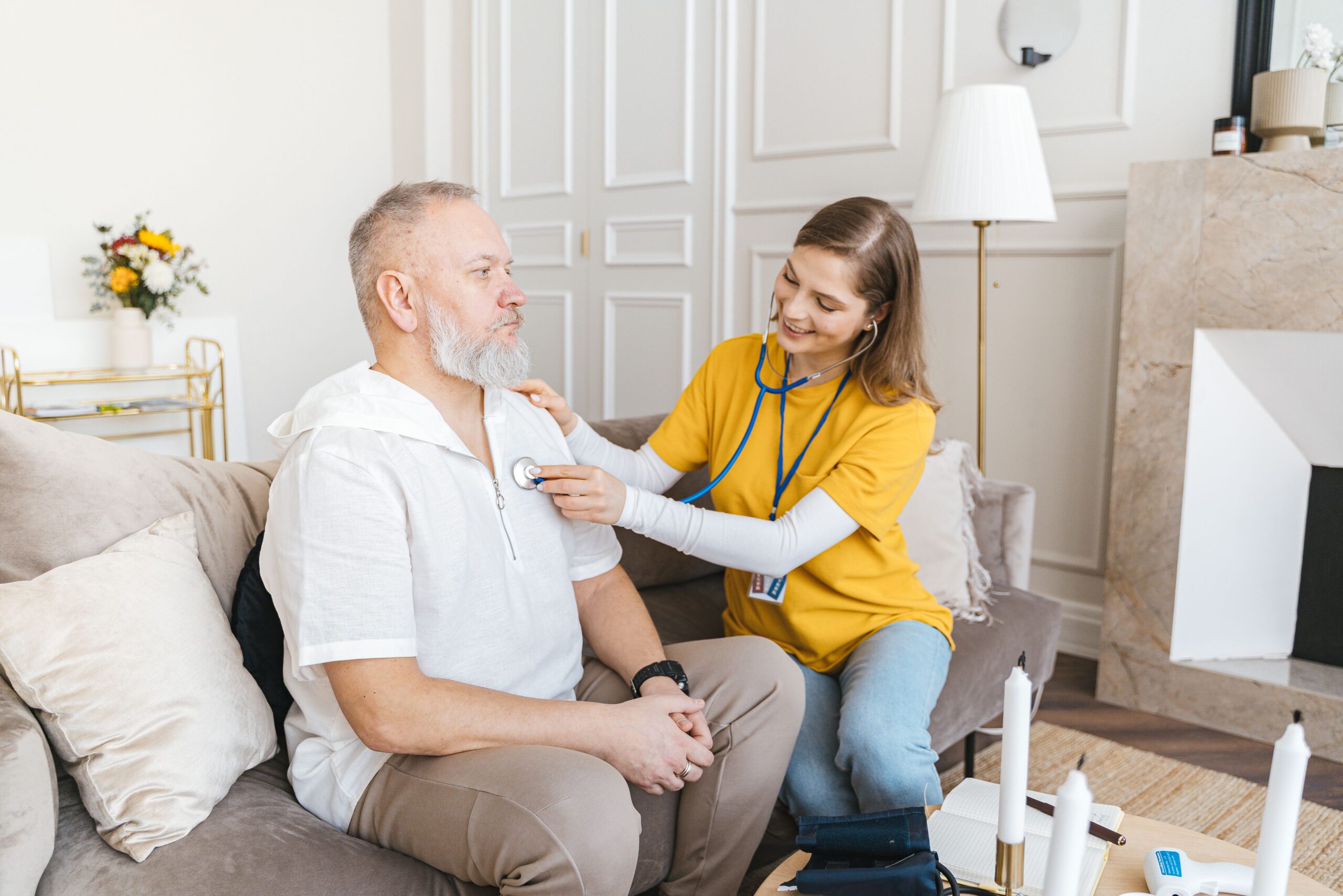 Healthcare professional providing continuing care services to a patient, supporting long-term recovery, wellness, and ongoing treatment after rehab.